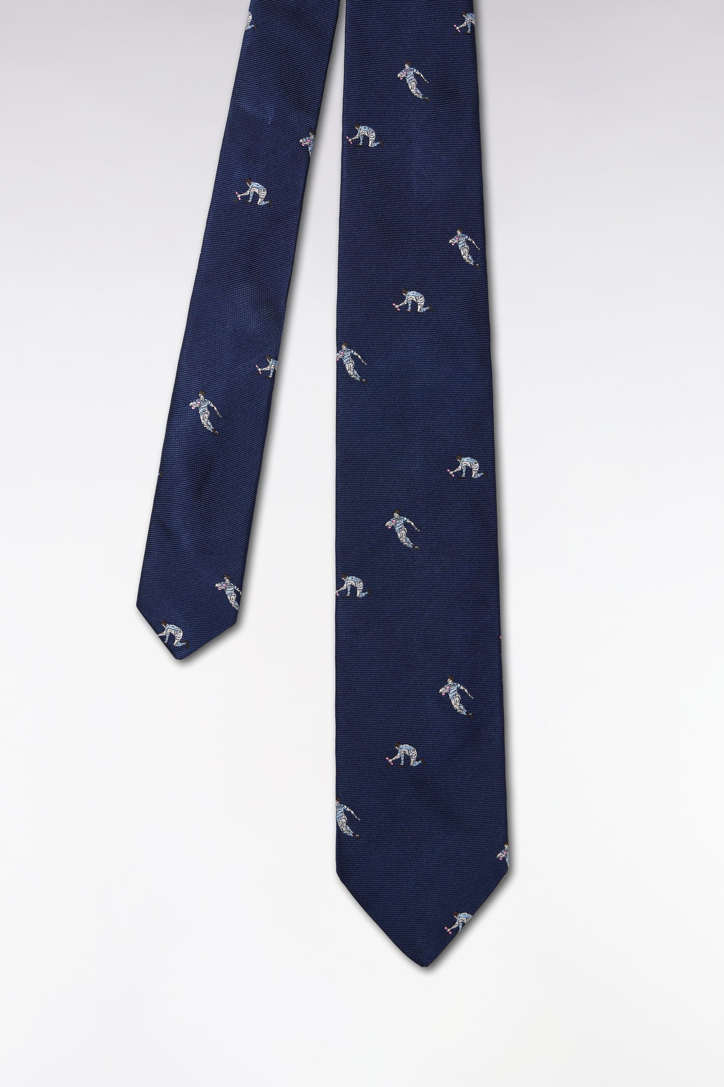 Indigo silk tie with rugby player motifs