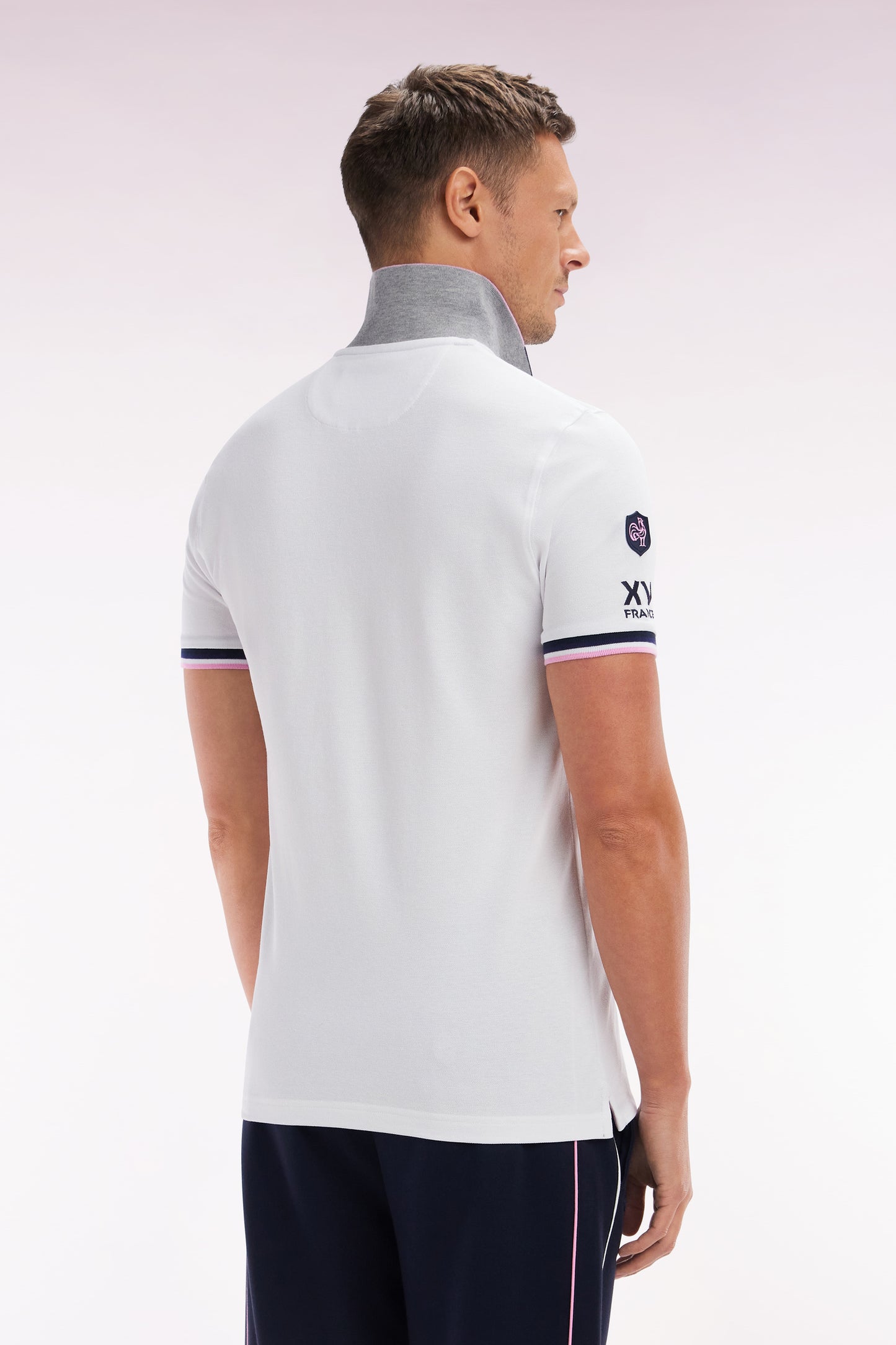 Slim-fit short-sleeved polo shirt in white stretch cotton with zipped collar