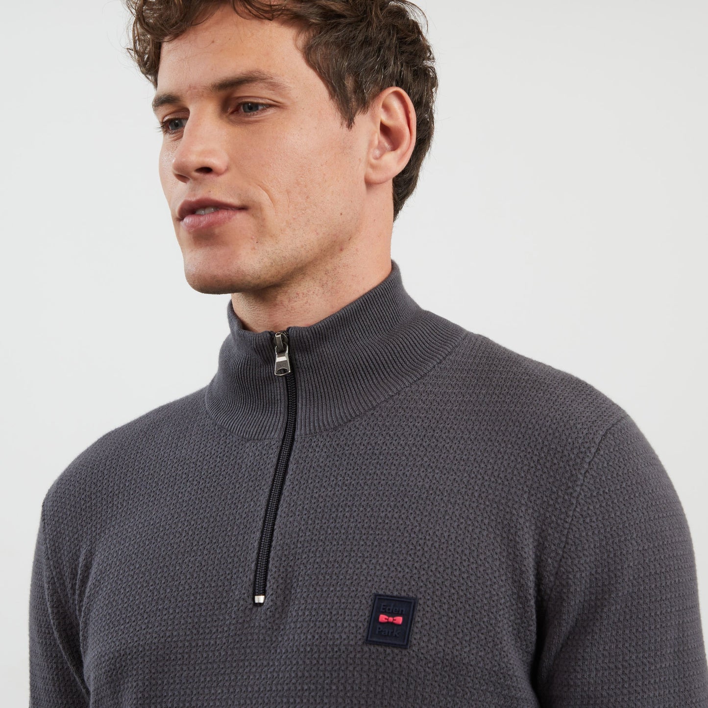 Dark grey zip-neck jumper in decorative cable knit