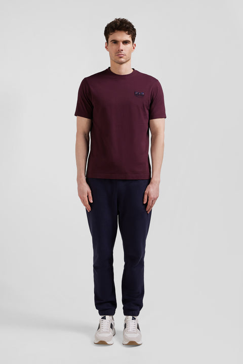 Regular burgundy short-sleeved cotton T-shirt with tie patchwork emblem - Image 1