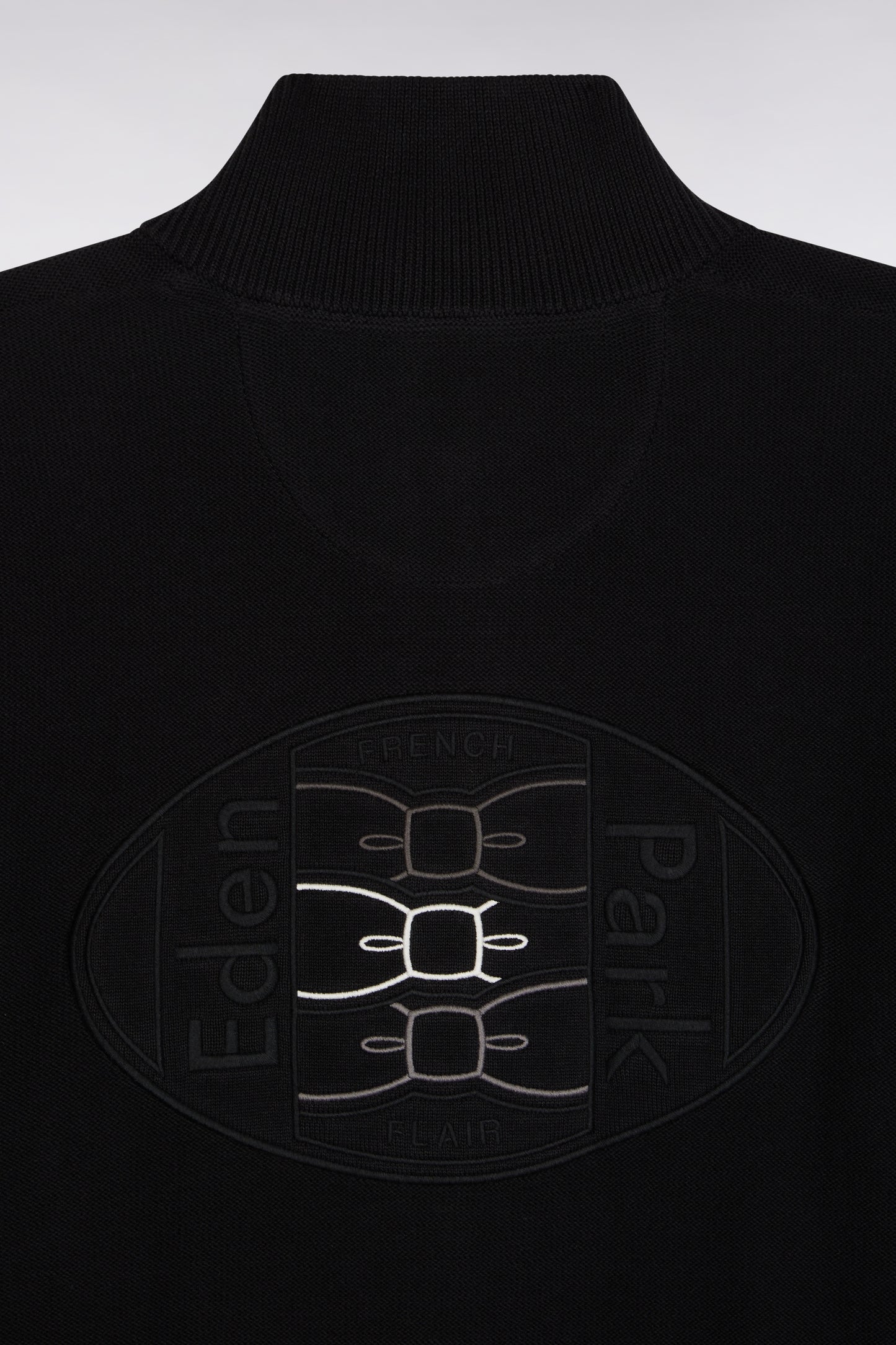 Zipped cardigan in black cotton with coloured piping, straight cut