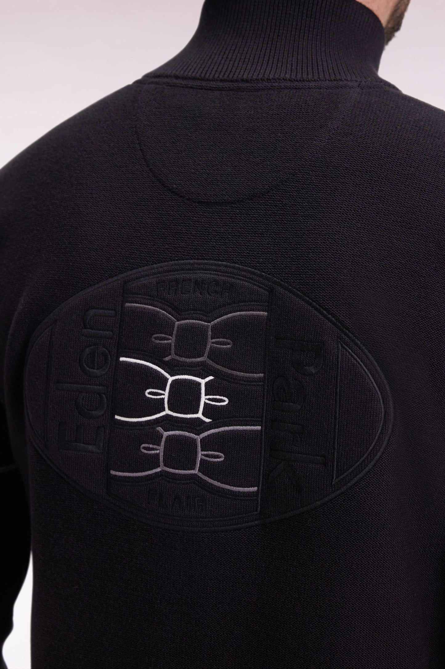 Zipped cardigan in black cotton with coloured piping, straight cut