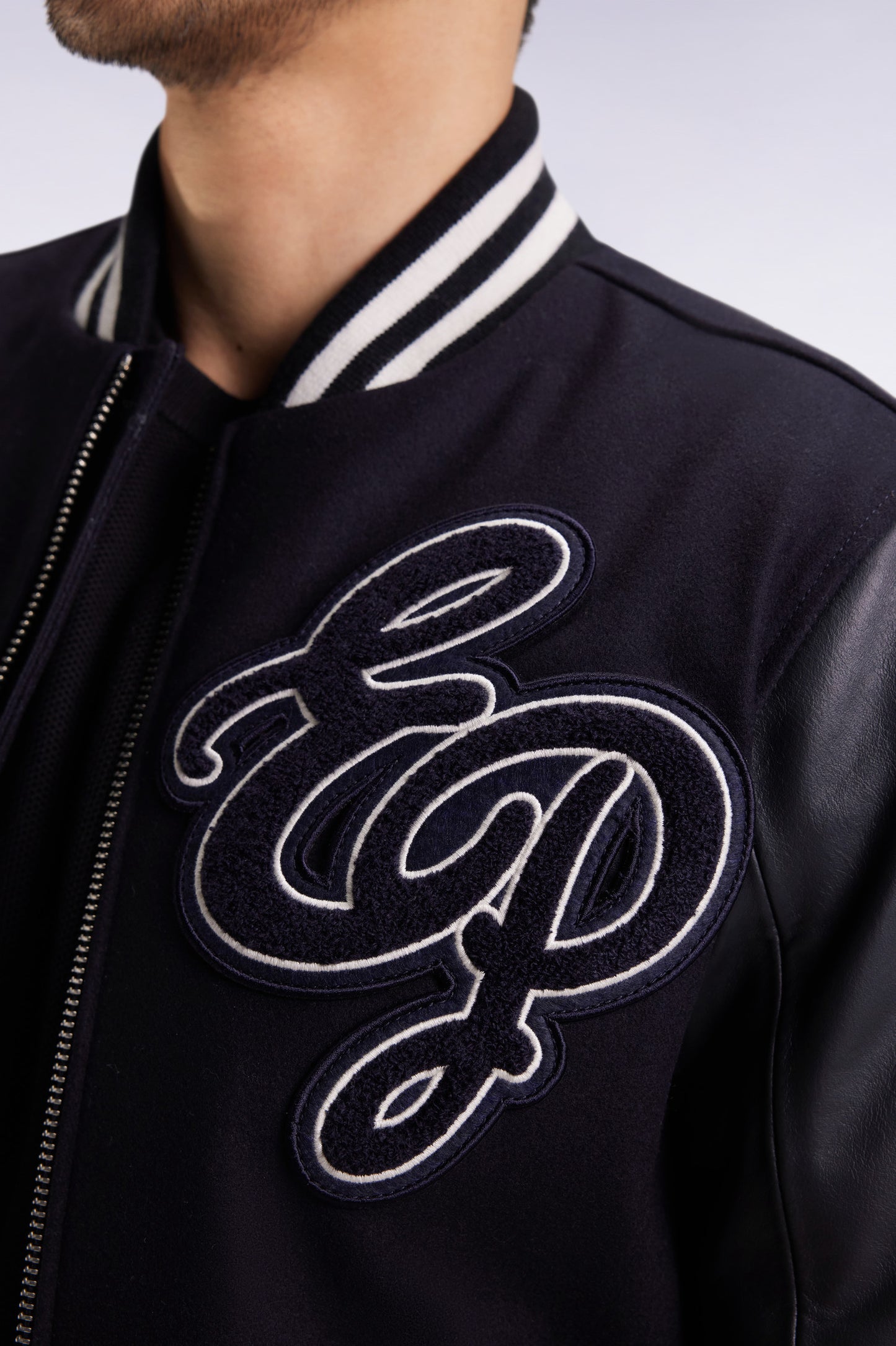 Two-tone teddy jacket with navy leather sleeves