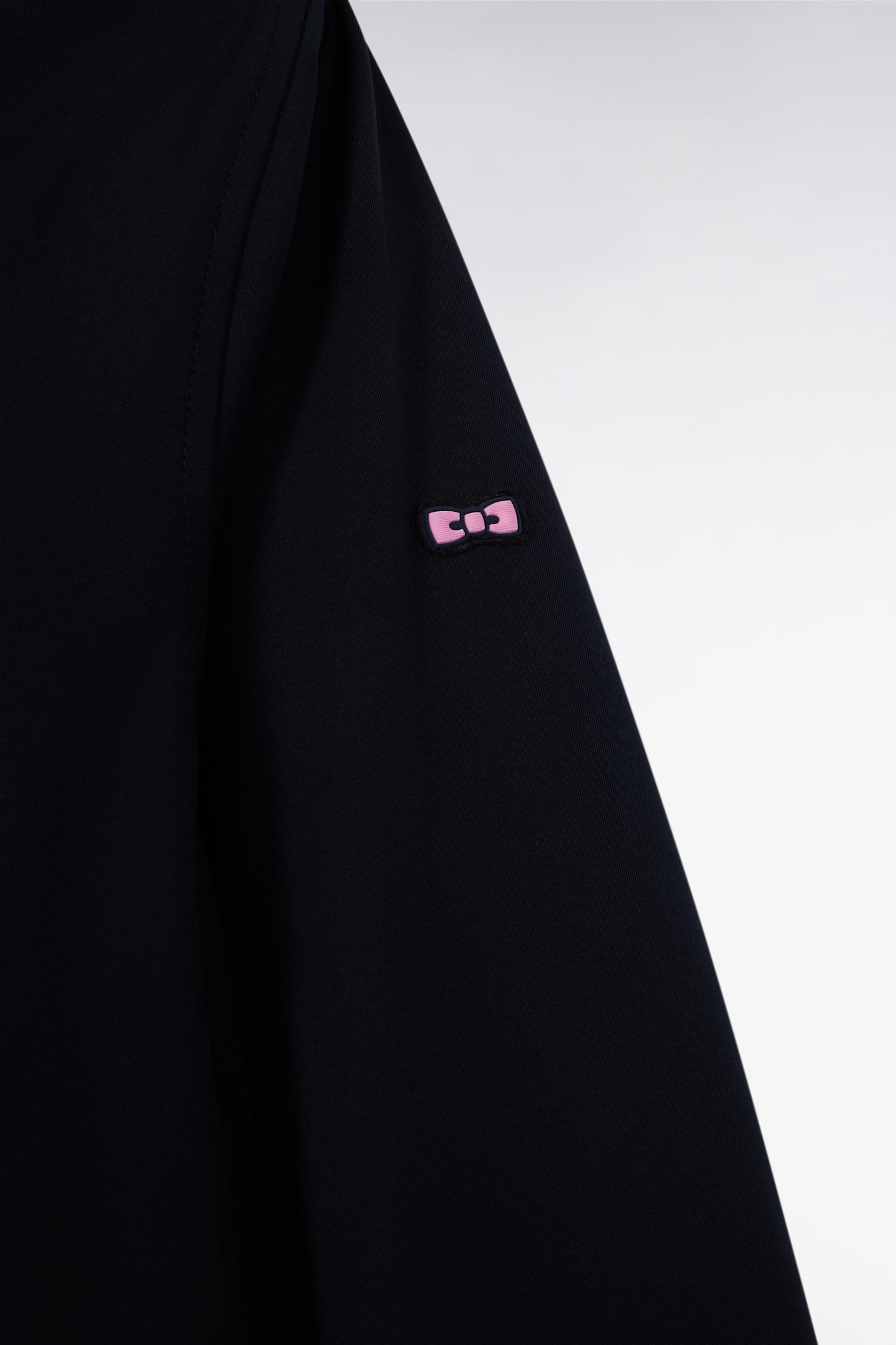 Long black nylon parka with integrated hood