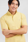 Plain yellow short-sleeved polo shirt