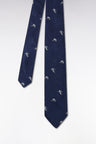 Indigo silk tie with rugby player motifs