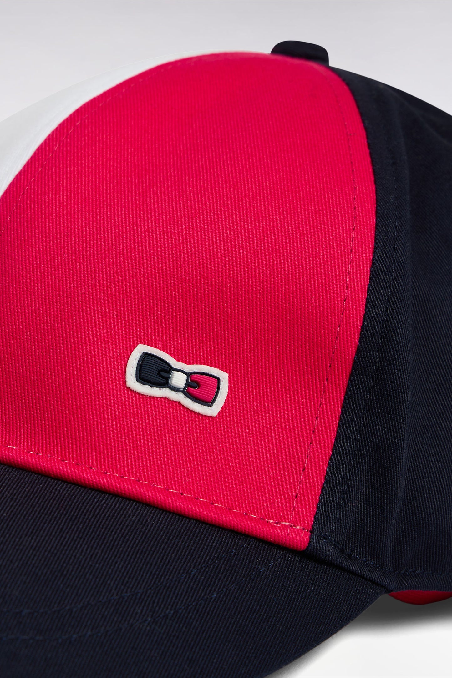 Fuchsia cap in navy cotton twill