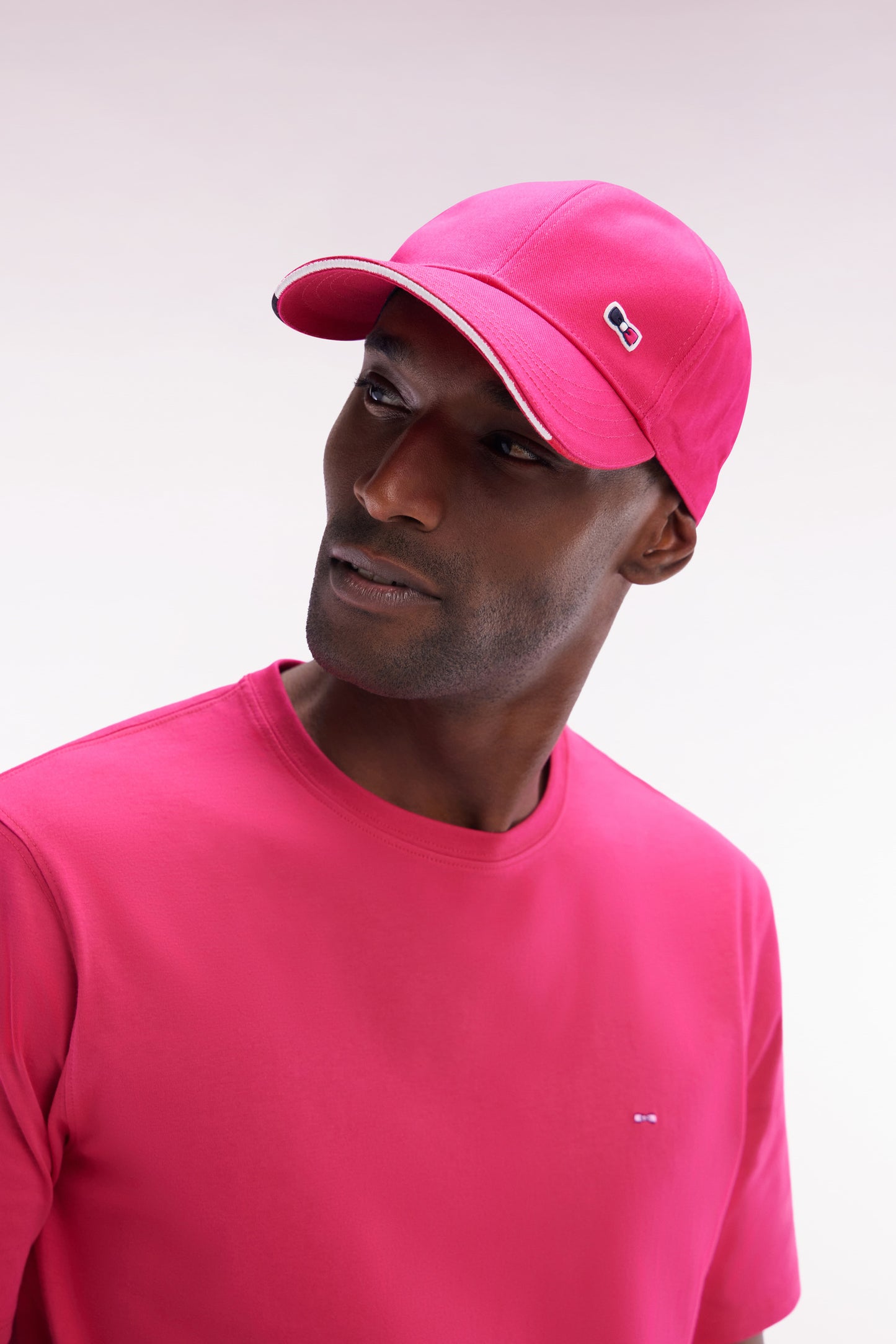 Fuchsia cotton twill cap with piped visor