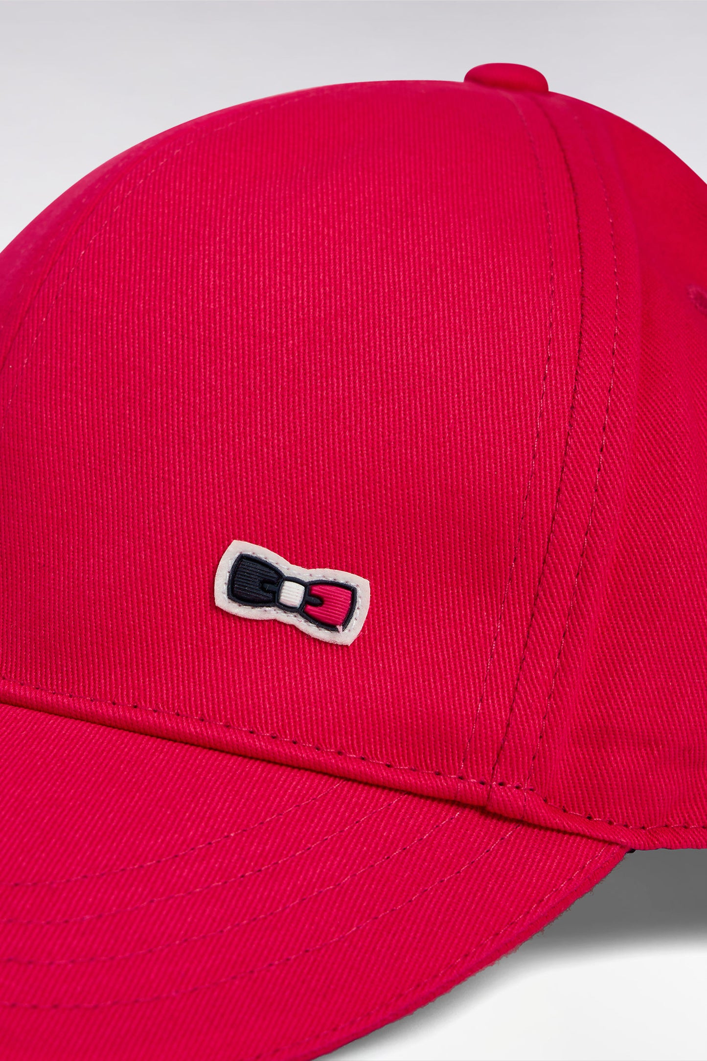 Fuchsia cotton twill cap with piped visor