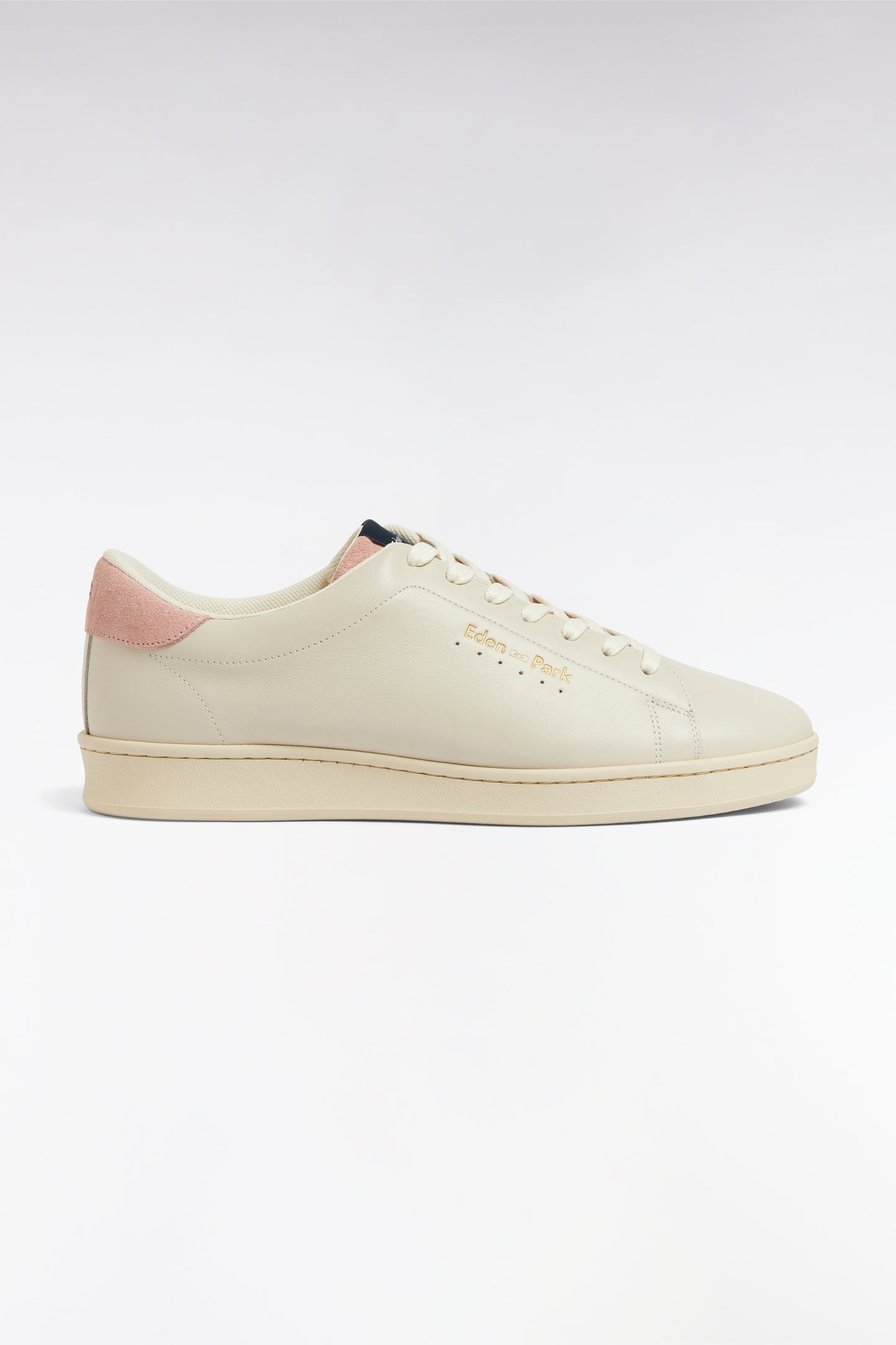 White leather low-top sneakers with pink accents