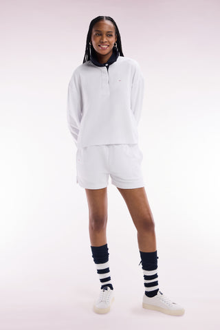White cotton sweatshirt with navy rugby shirt collar