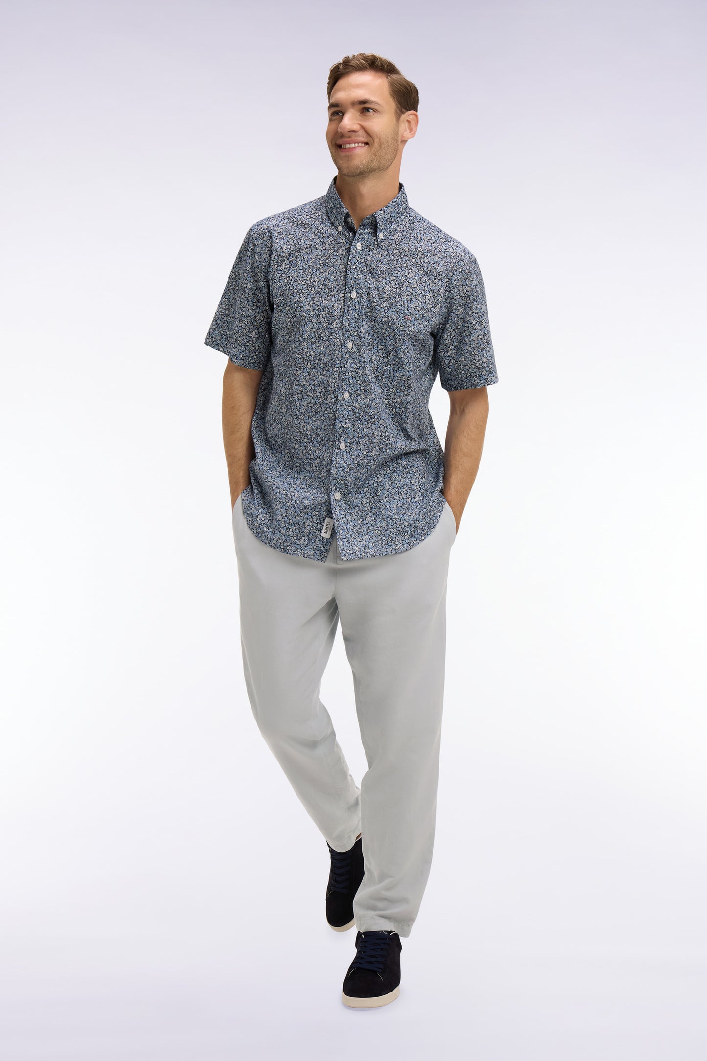 Short-sleeved blue cotton shirt with floral micro-pattern