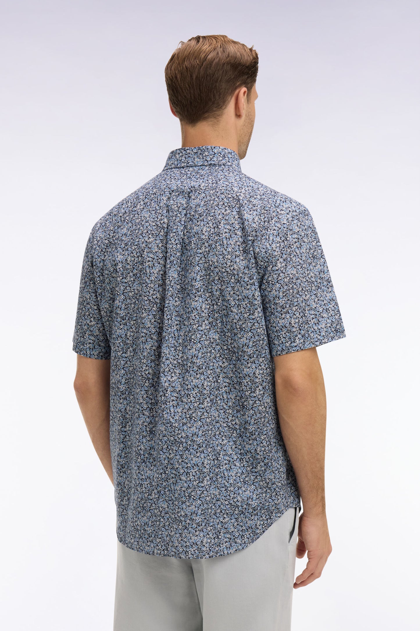 Short-sleeved blue cotton shirt with floral micro-pattern