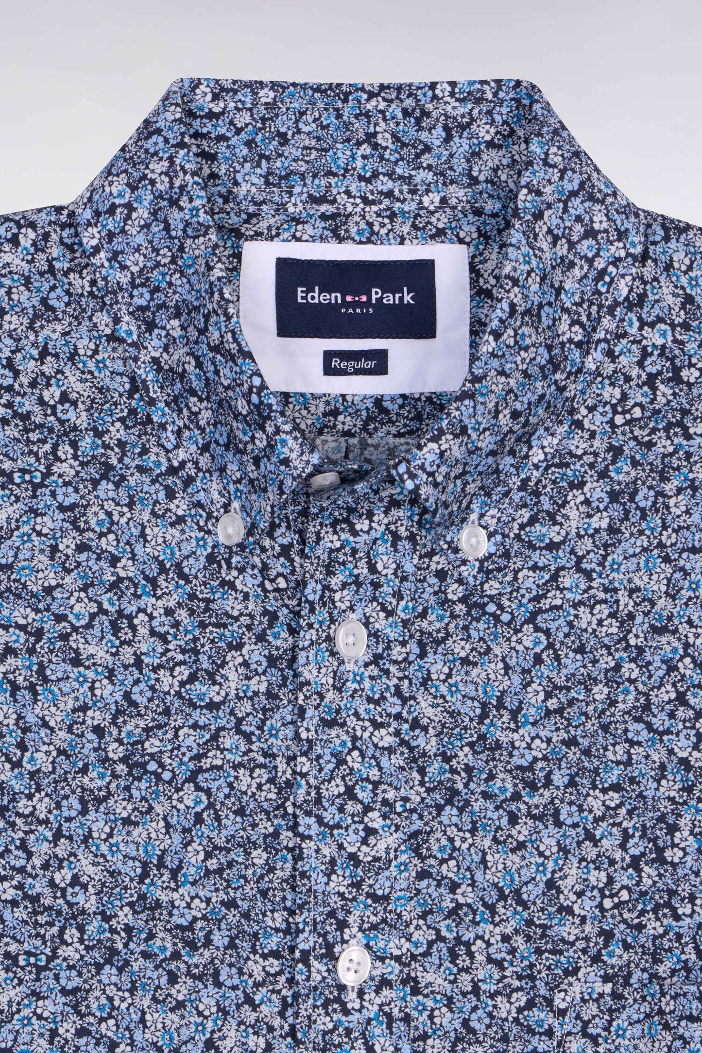 Short-sleeved blue cotton shirt with floral micro-pattern