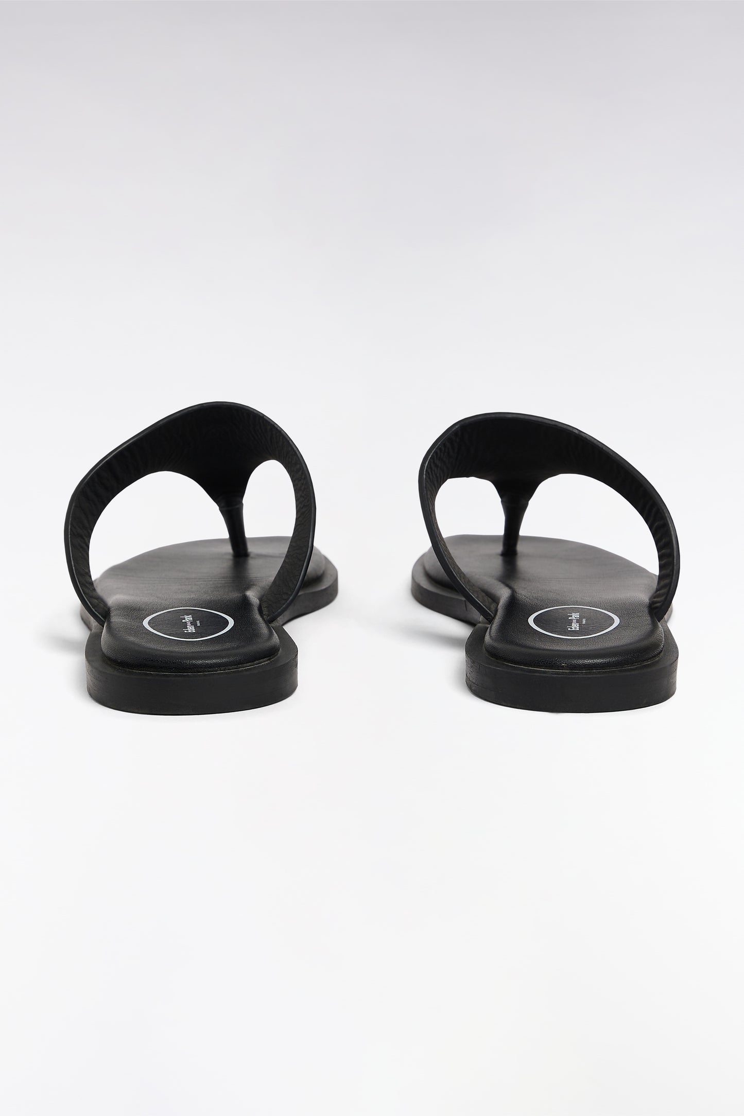 Black cowhide thong sandals
