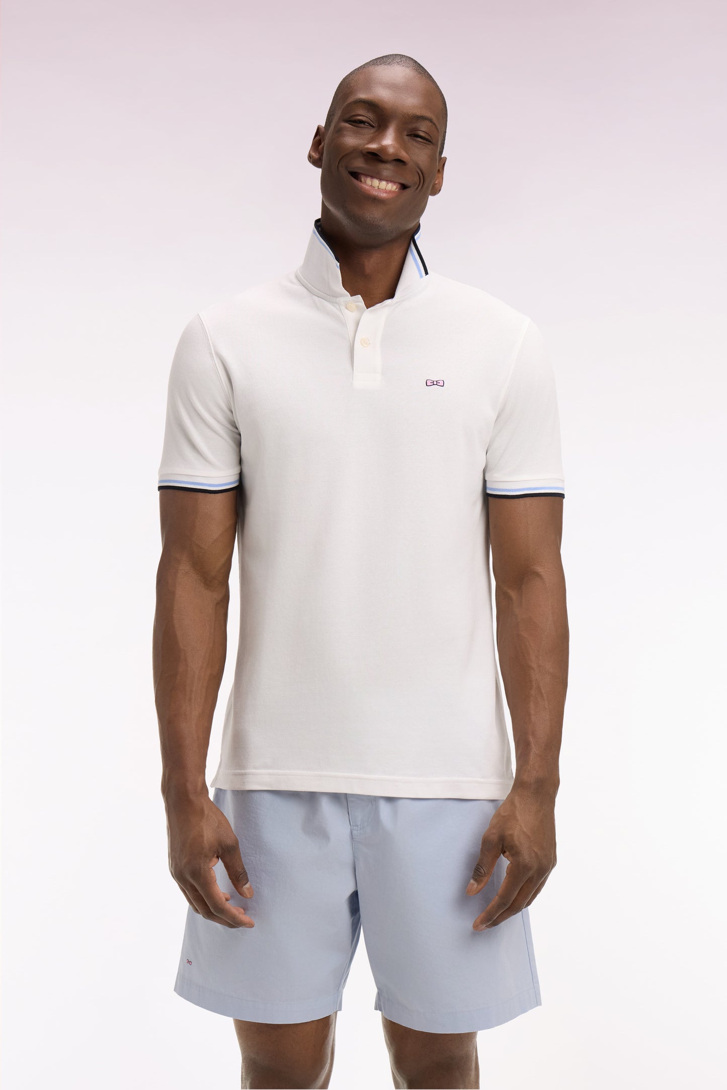 Short-sleeved white cotton polo shirt with striped details, regular fit