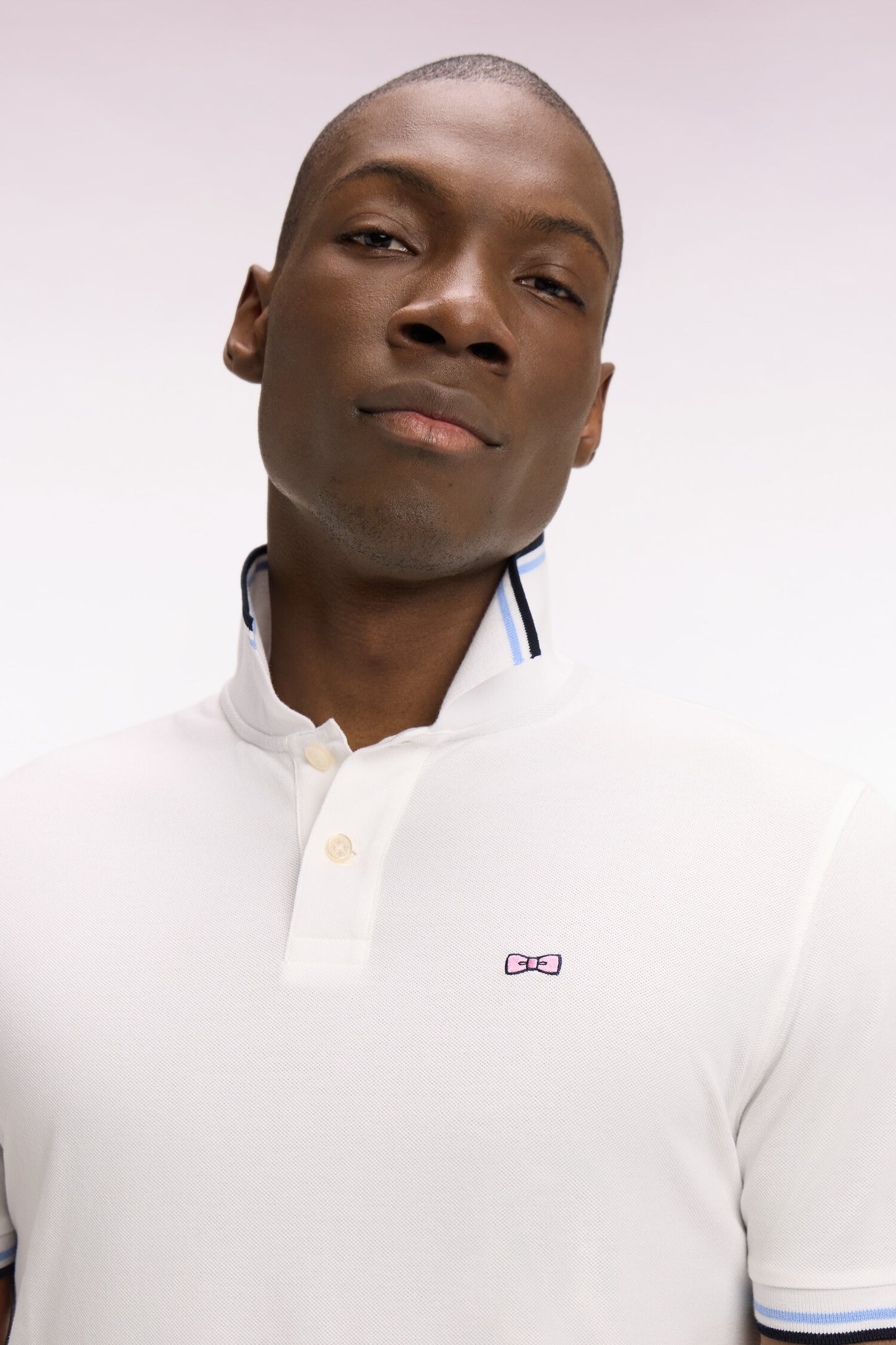 Short-sleeved white cotton polo shirt with striped details, regular fit