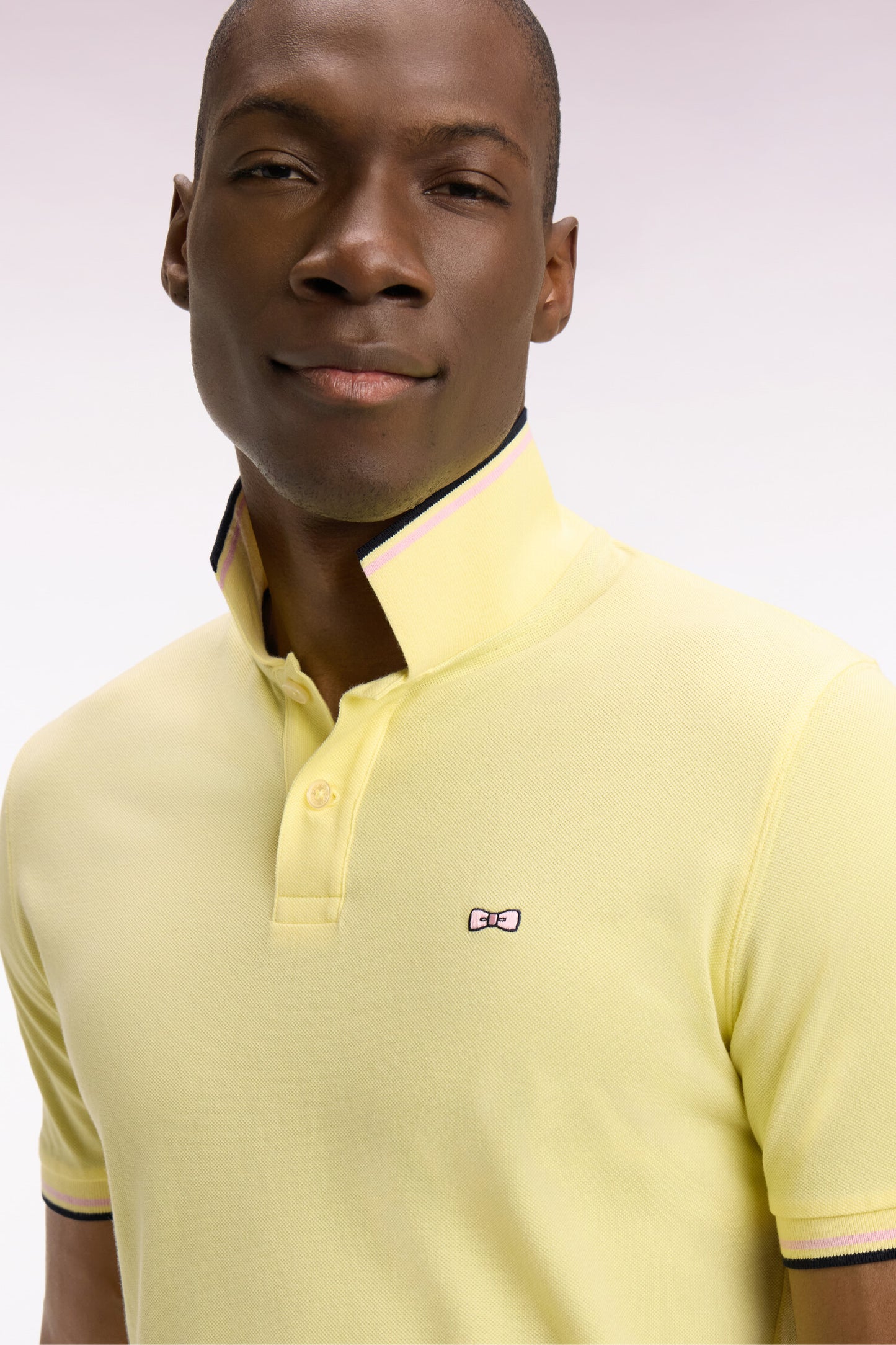 Short-sleeved polo shirt in yellow cotton with striped details, regular fit