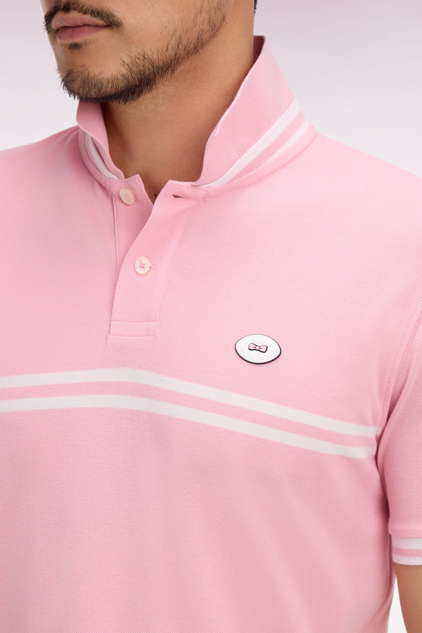 Polo à manches courtes en coton rose à rayures blanches coupe regular