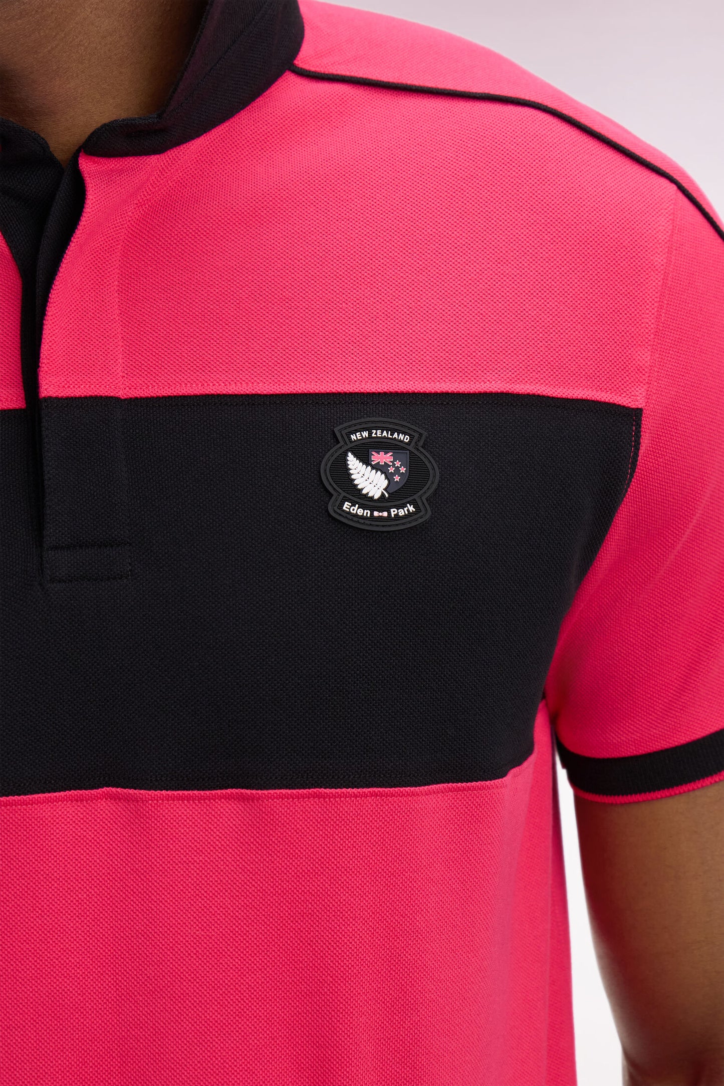 Polo à manches courtes en coton fuchsia et noir New Zealand coupe regular