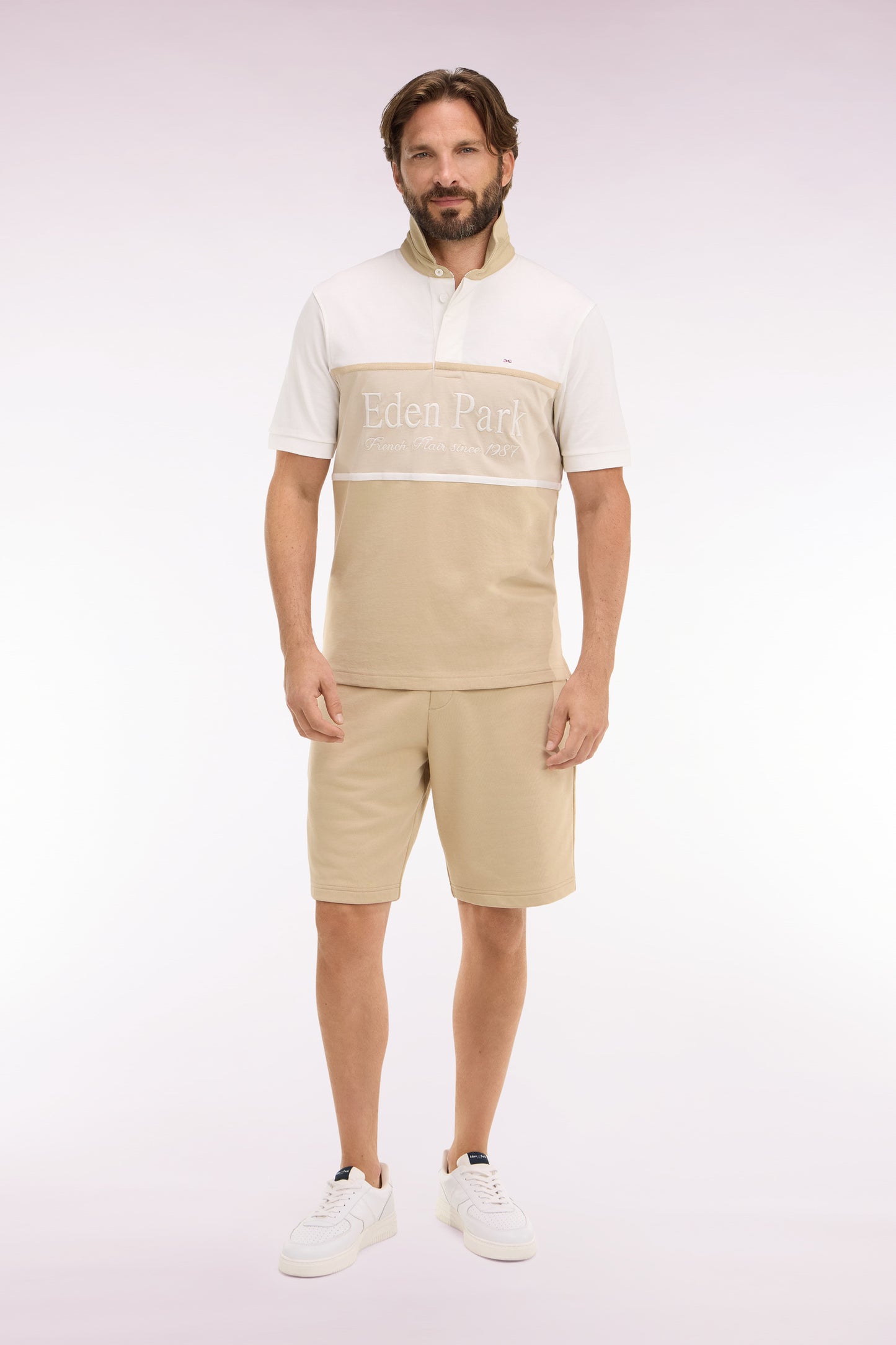 Beige cotton fleece shorts with coat of arms embroidery