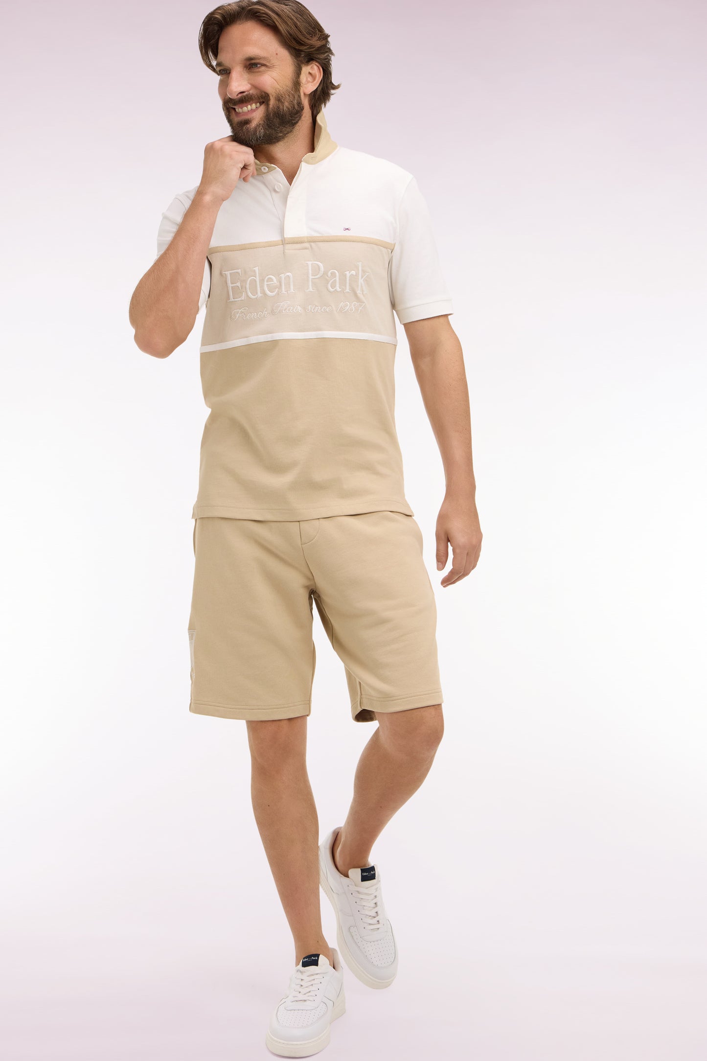 Beige cotton fleece shorts with coat of arms embroidery