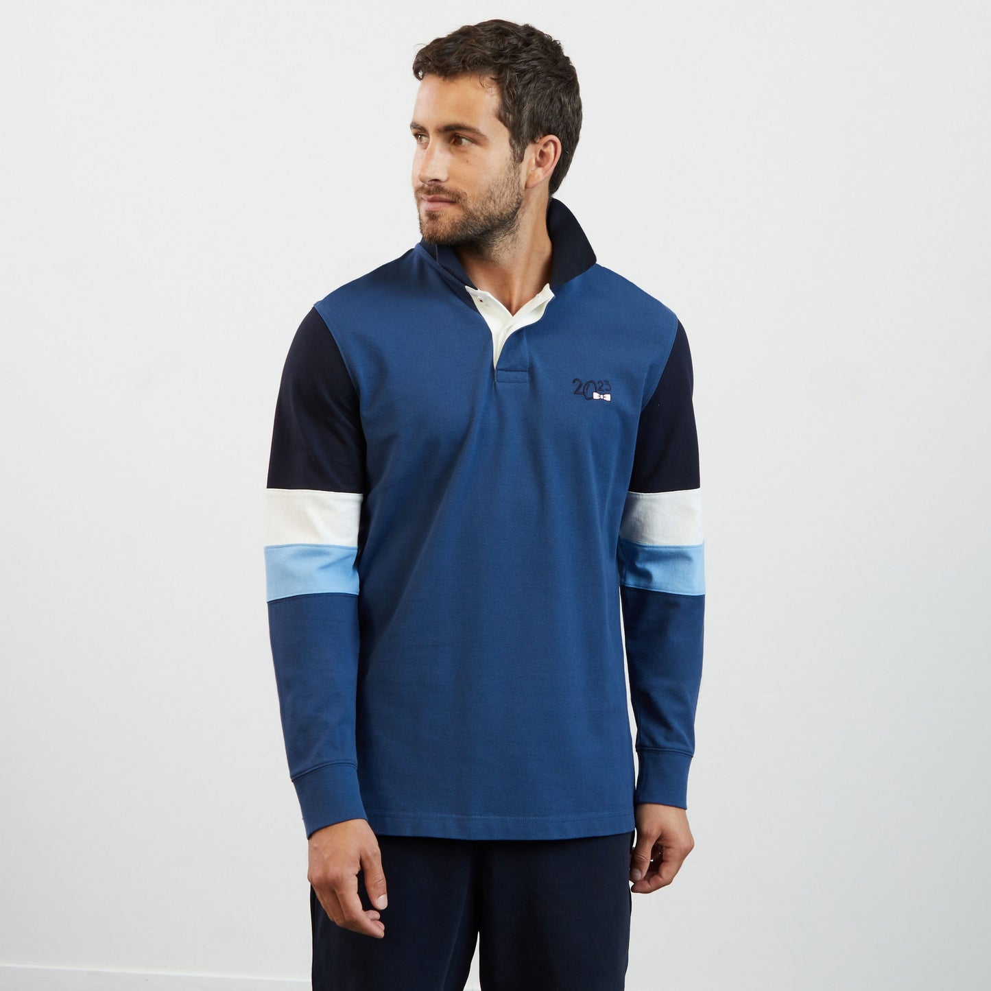 Blue colourblock polo shirt with 2023 embroidery