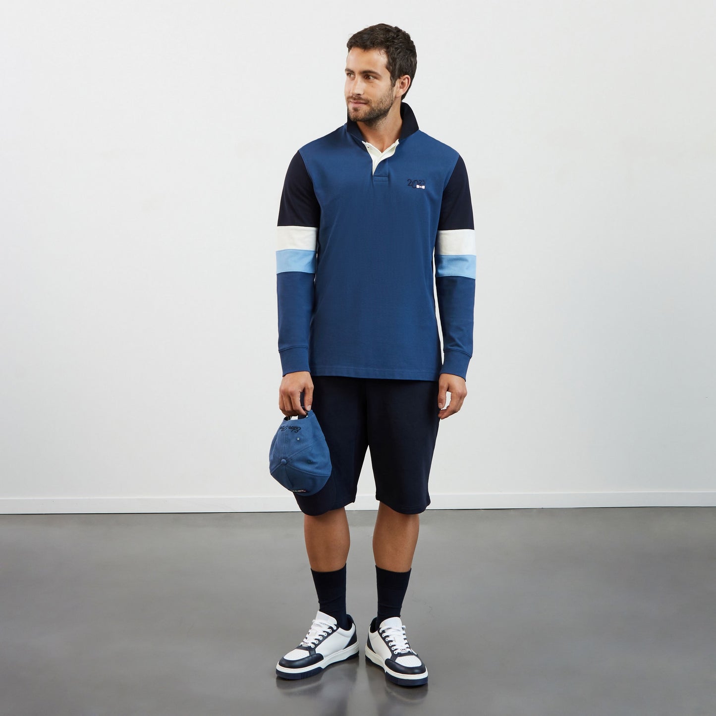 Blue colourblock polo shirt with 2023 embroidery