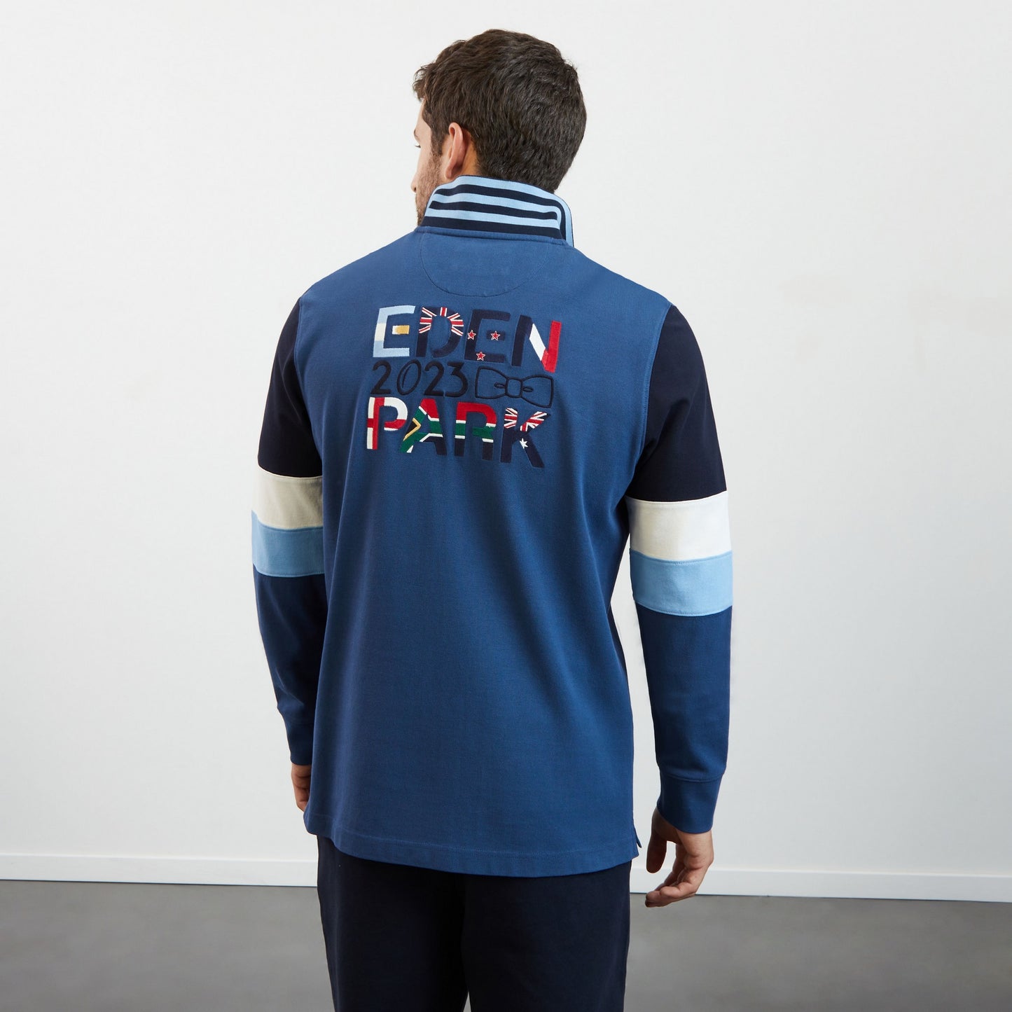 Blue colourblock polo shirt with 2023 embroidery