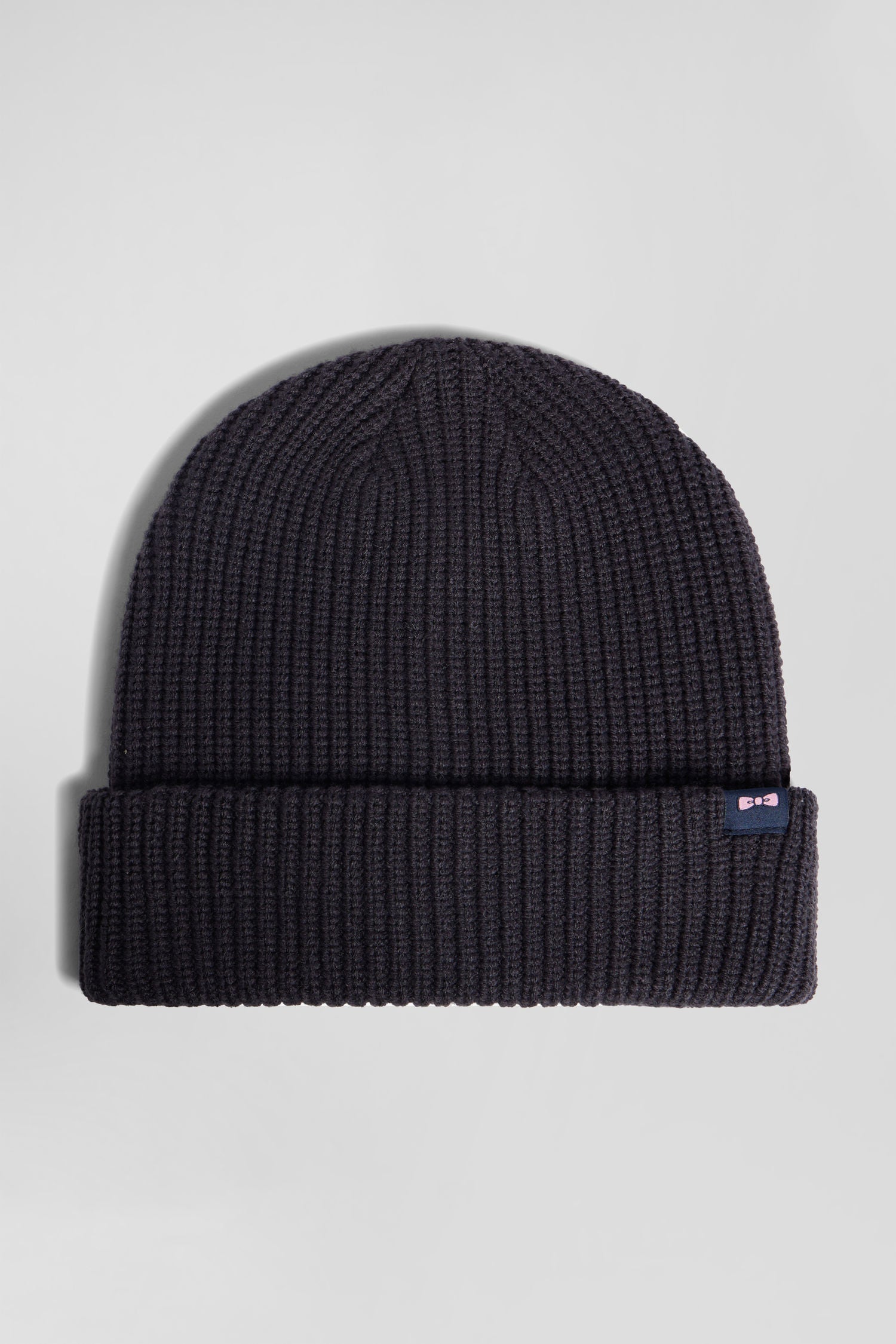 Navy blue knitted beanie with bow tie embroidery