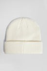 Ivory knitted beanie with bow tie embroidery