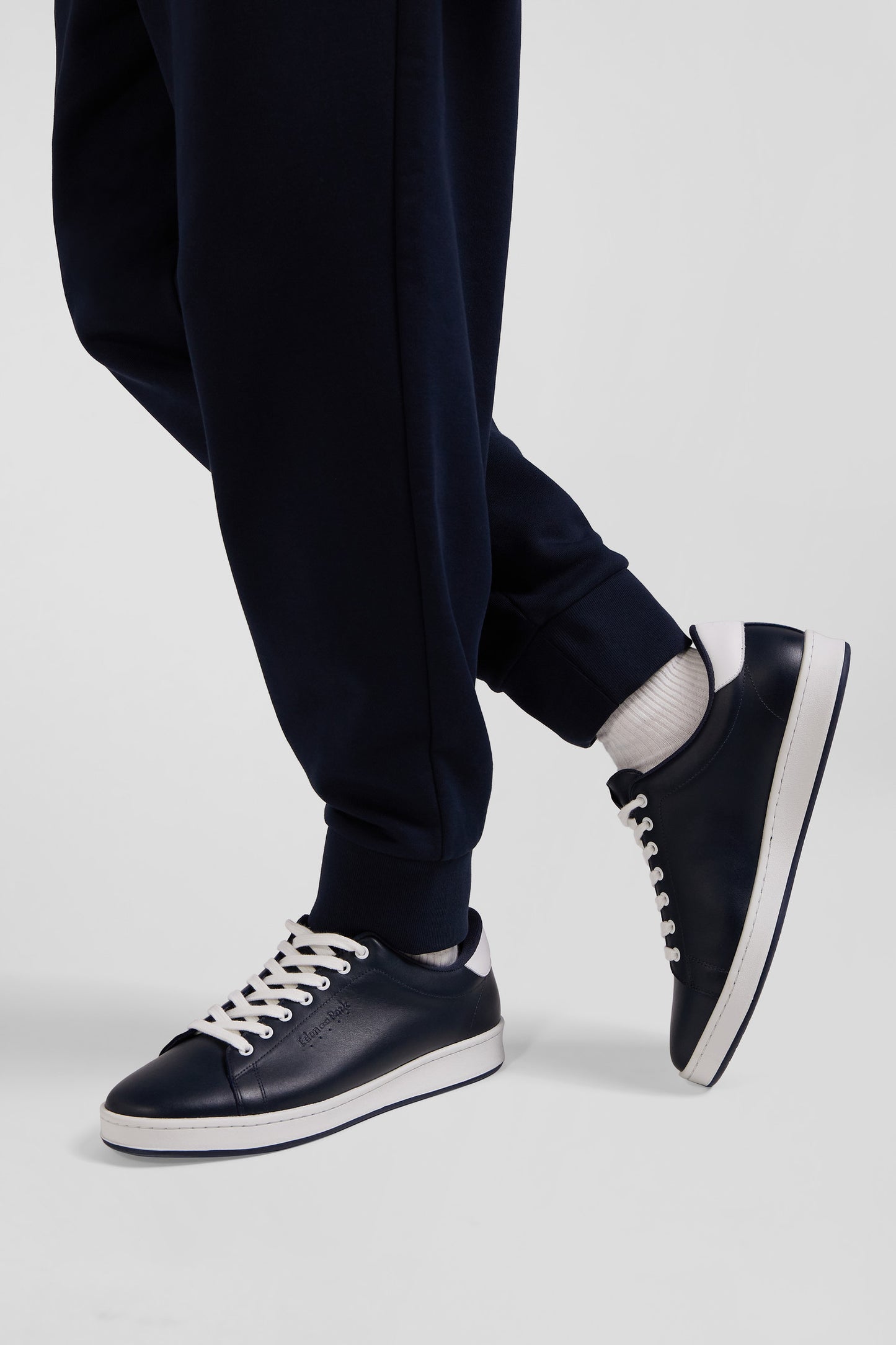 Navy blue low-top leather sneakers