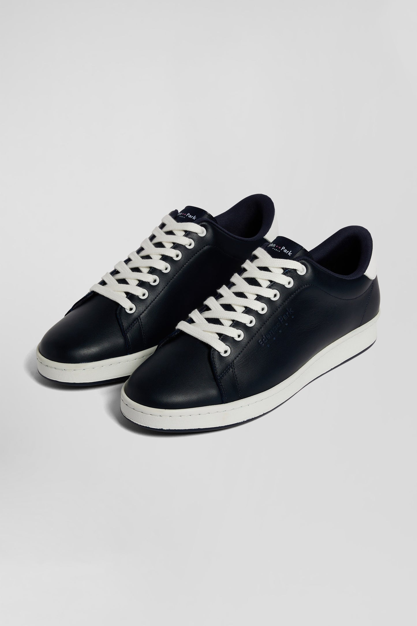 Navy blue low-top leather sneakers