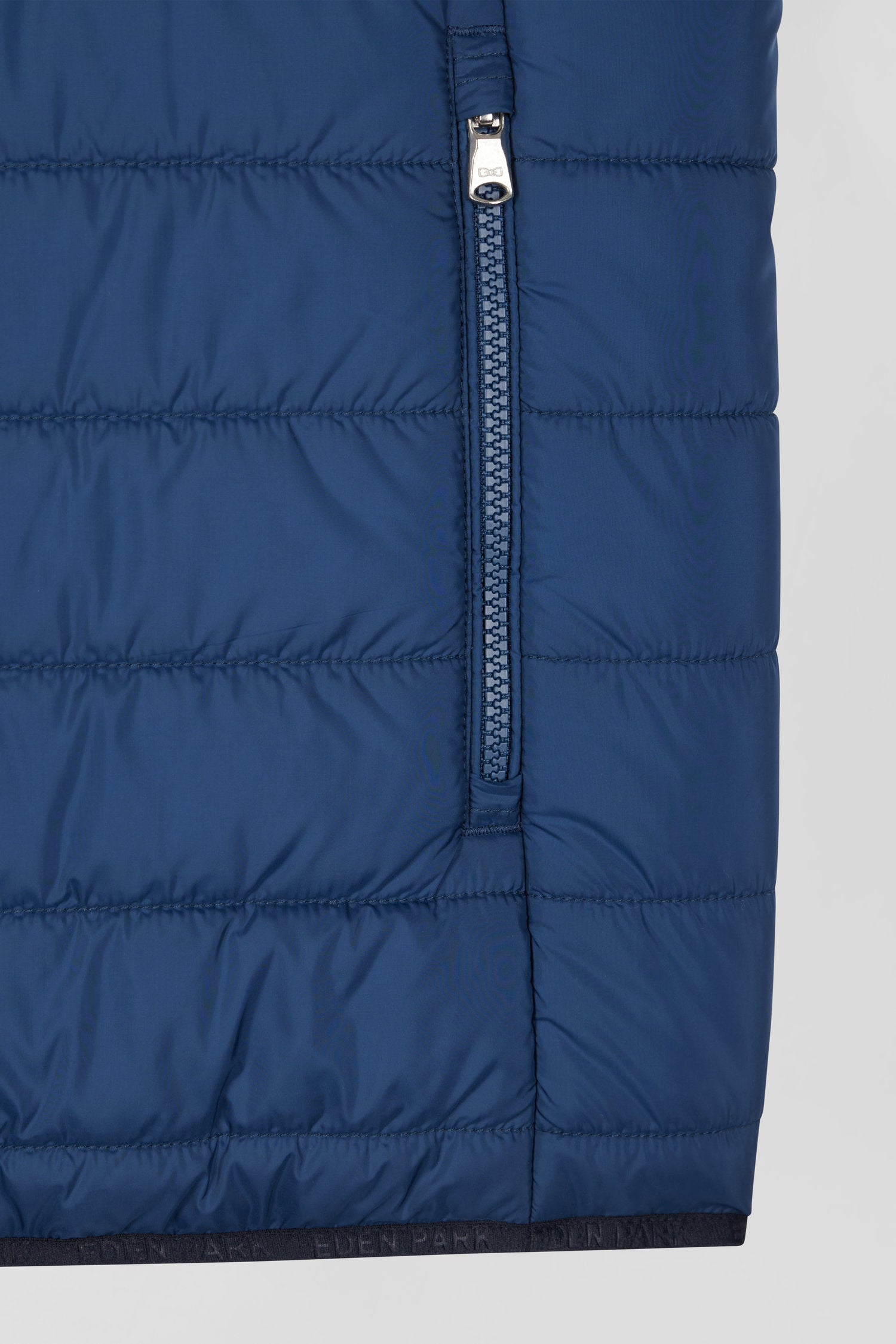 Blue quilted sleeveless high collar down vest