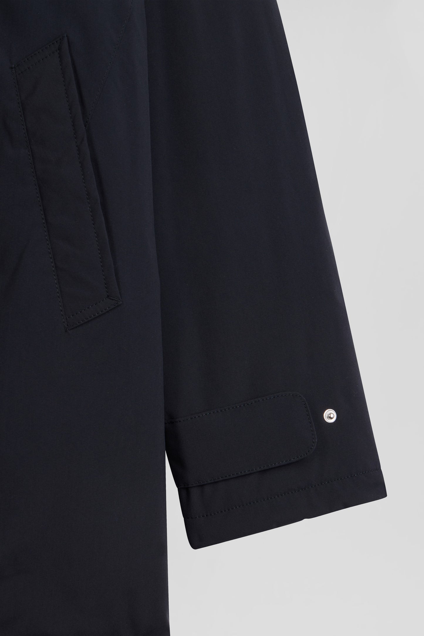 Navy blue hooded nylon raincoat