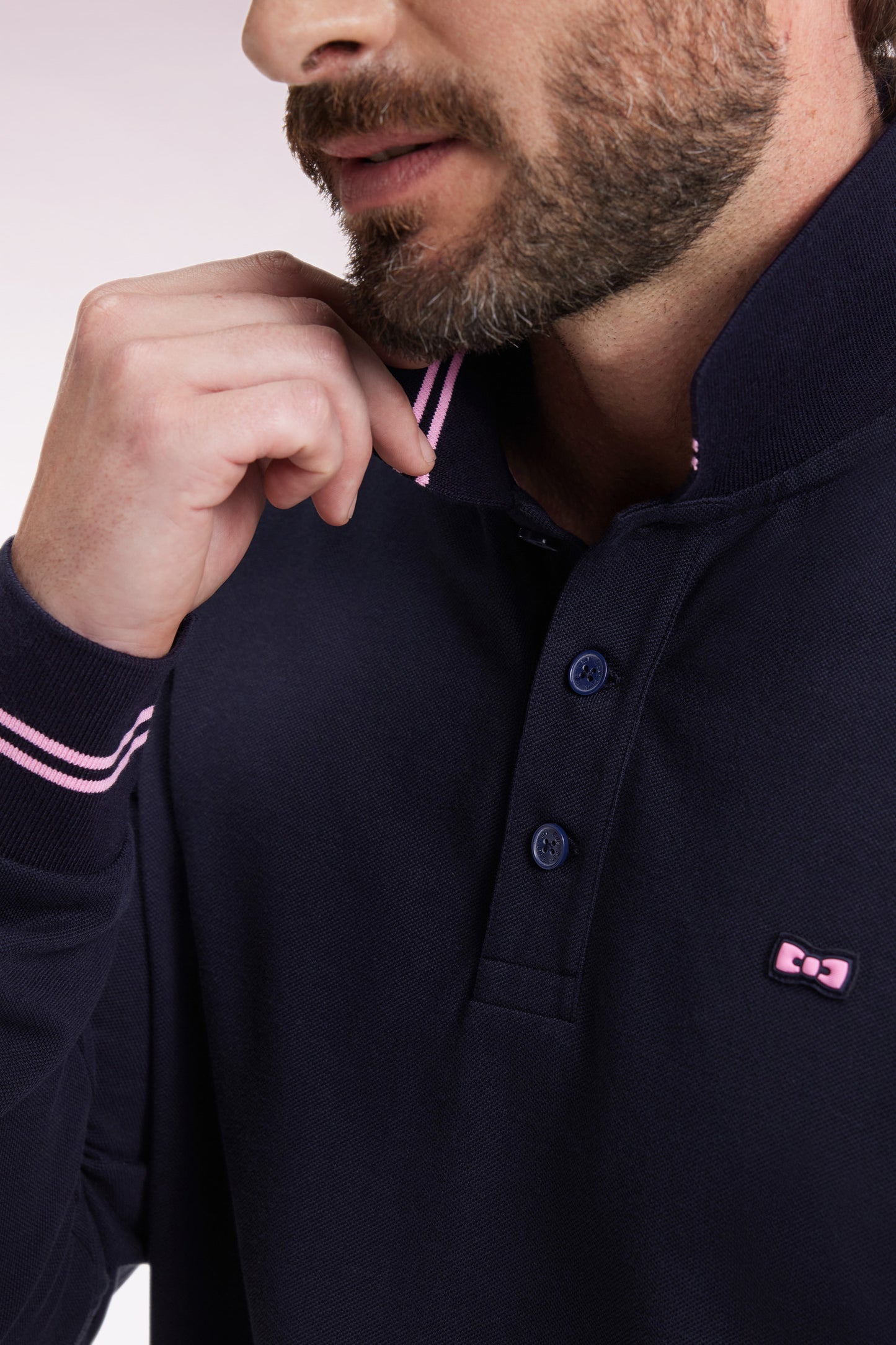 Long-sleeved polo shirt in navy cotton piqué with striped collar.