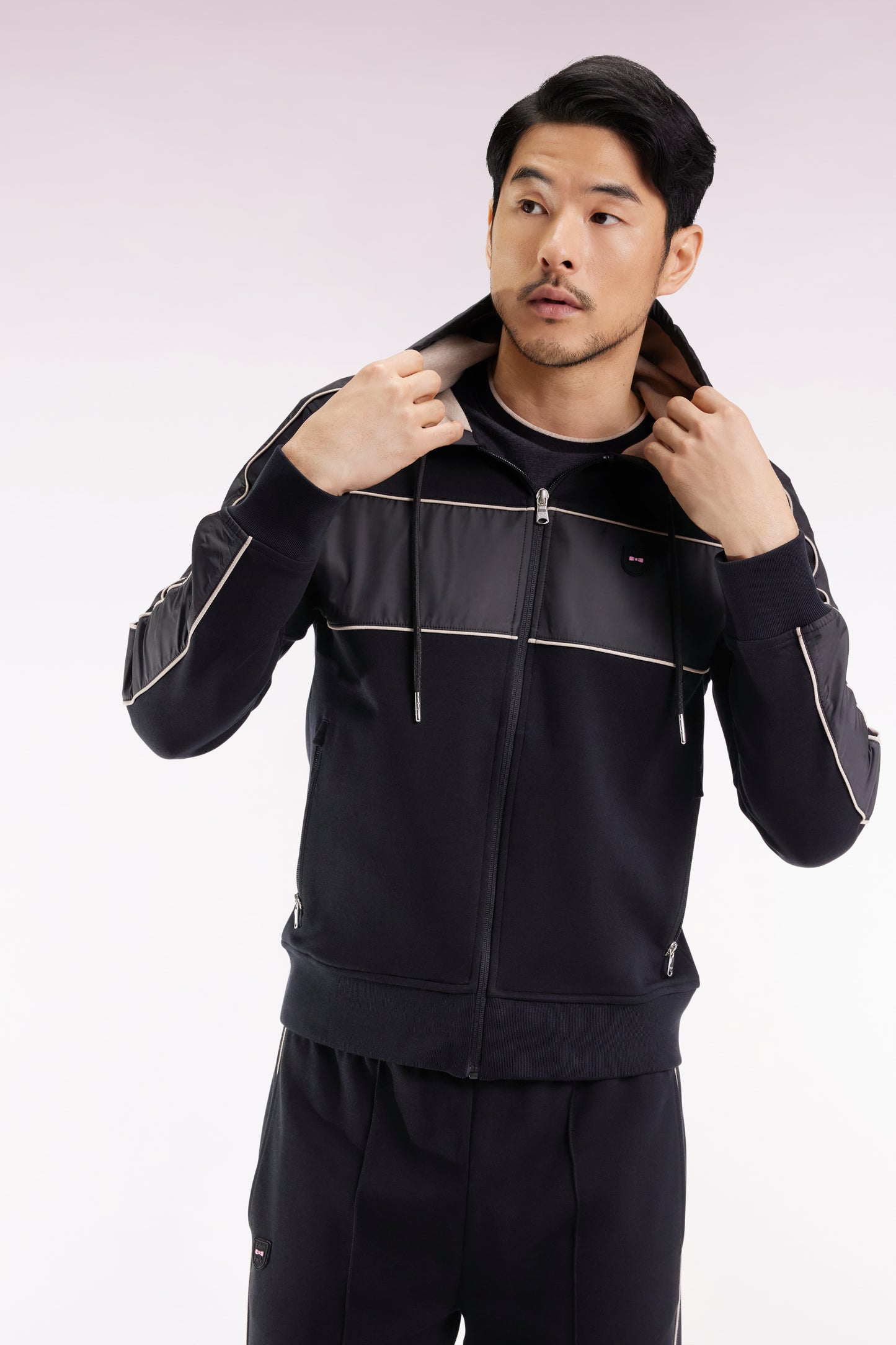 Zip-up hooded sweatshirt in black and beige fleece and nylon
