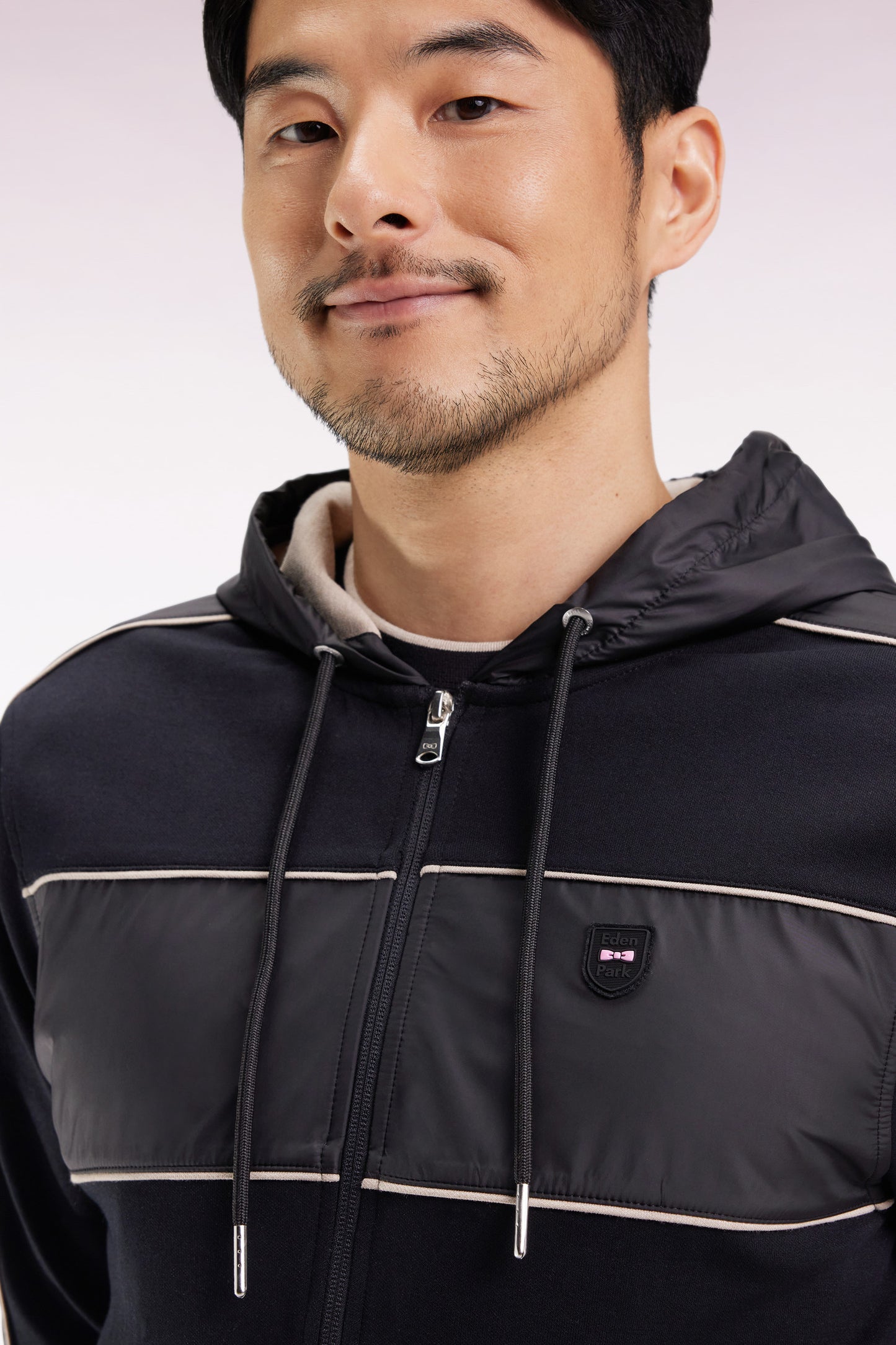 Zip-up hooded sweatshirt in black and beige fleece and nylon