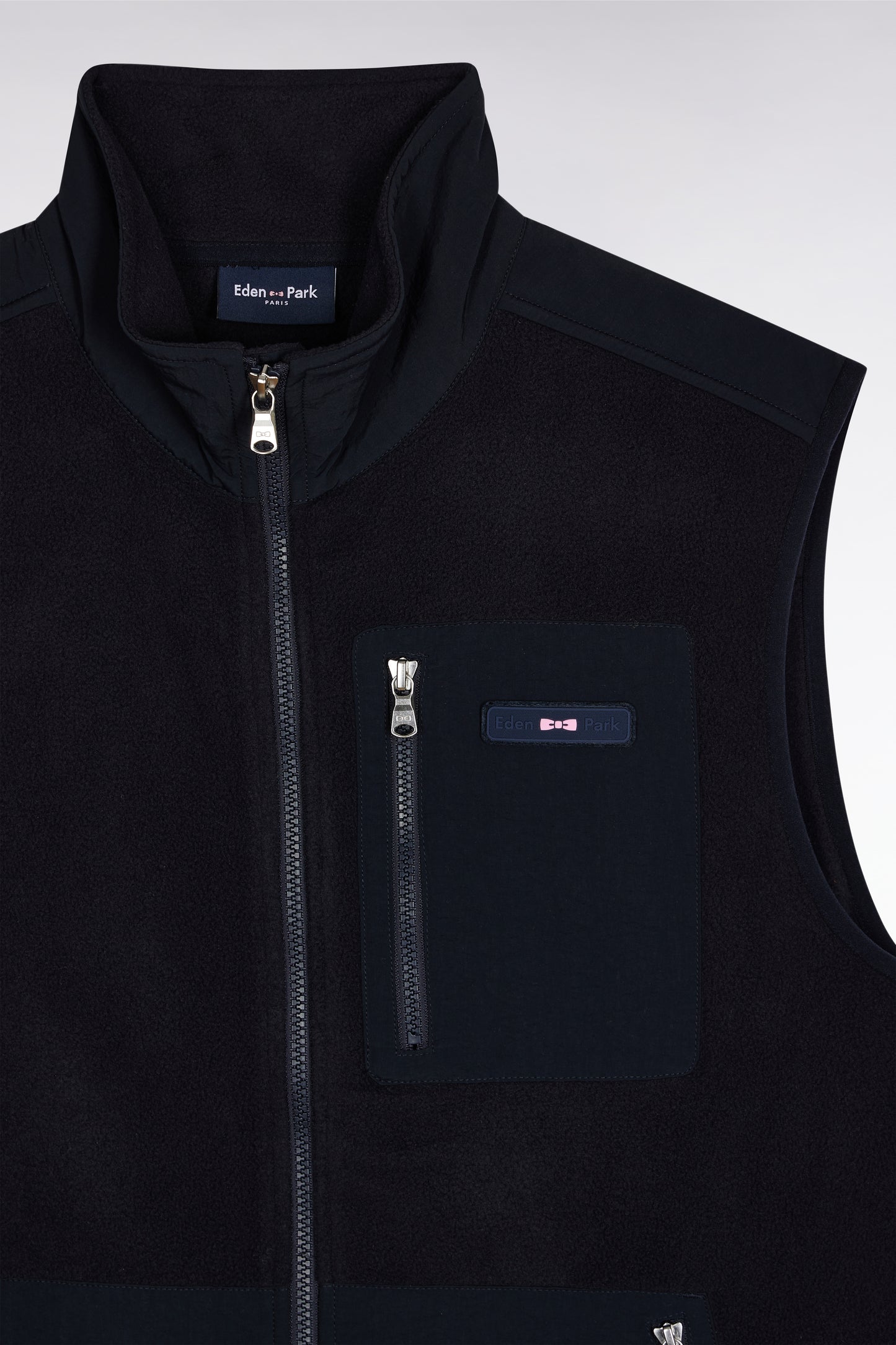 Sleeveless zip-up hooded sweatshirt in navy with straight cut.