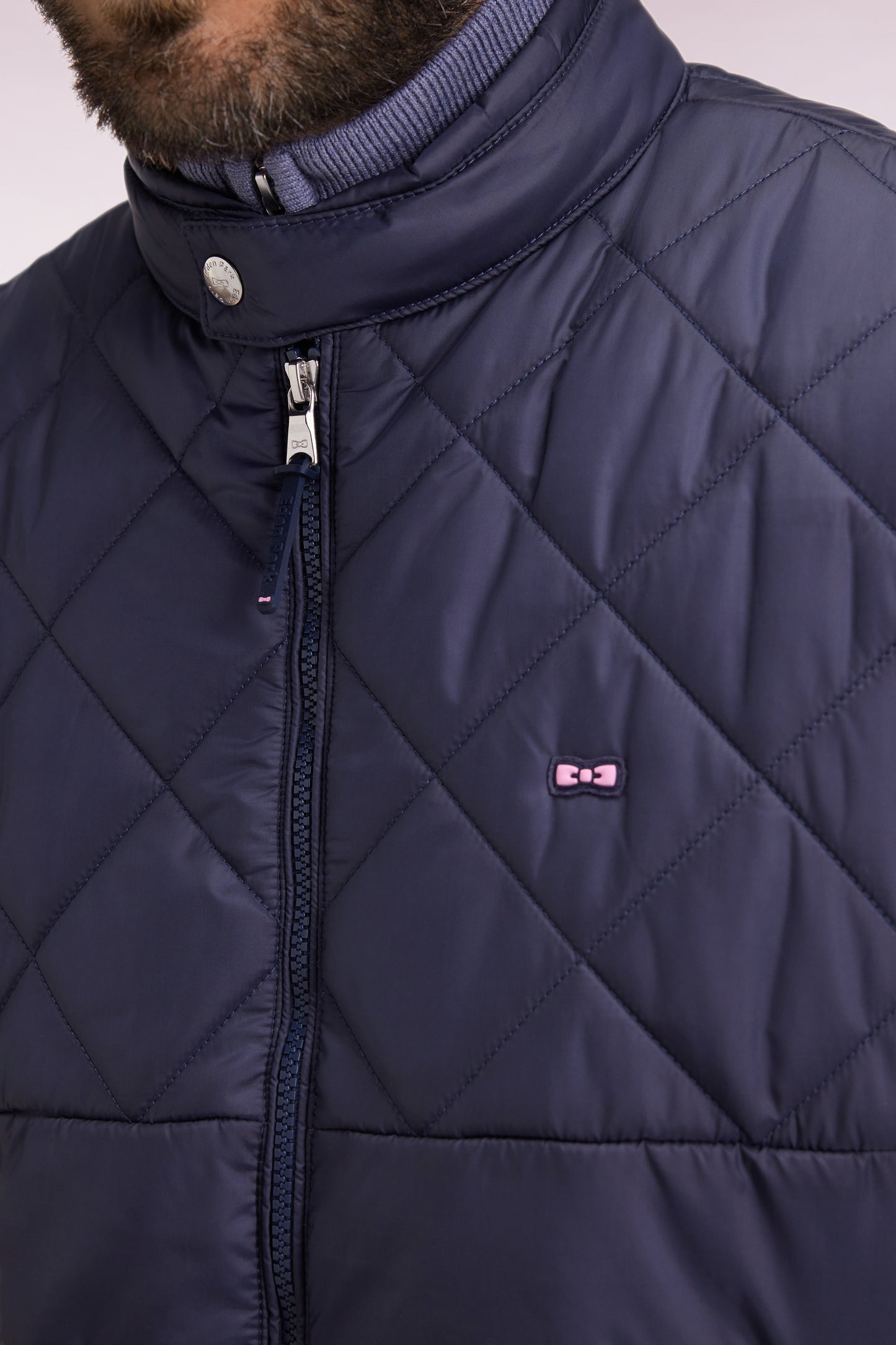 Sleeveless biker-neck padded nylon jacket in grey