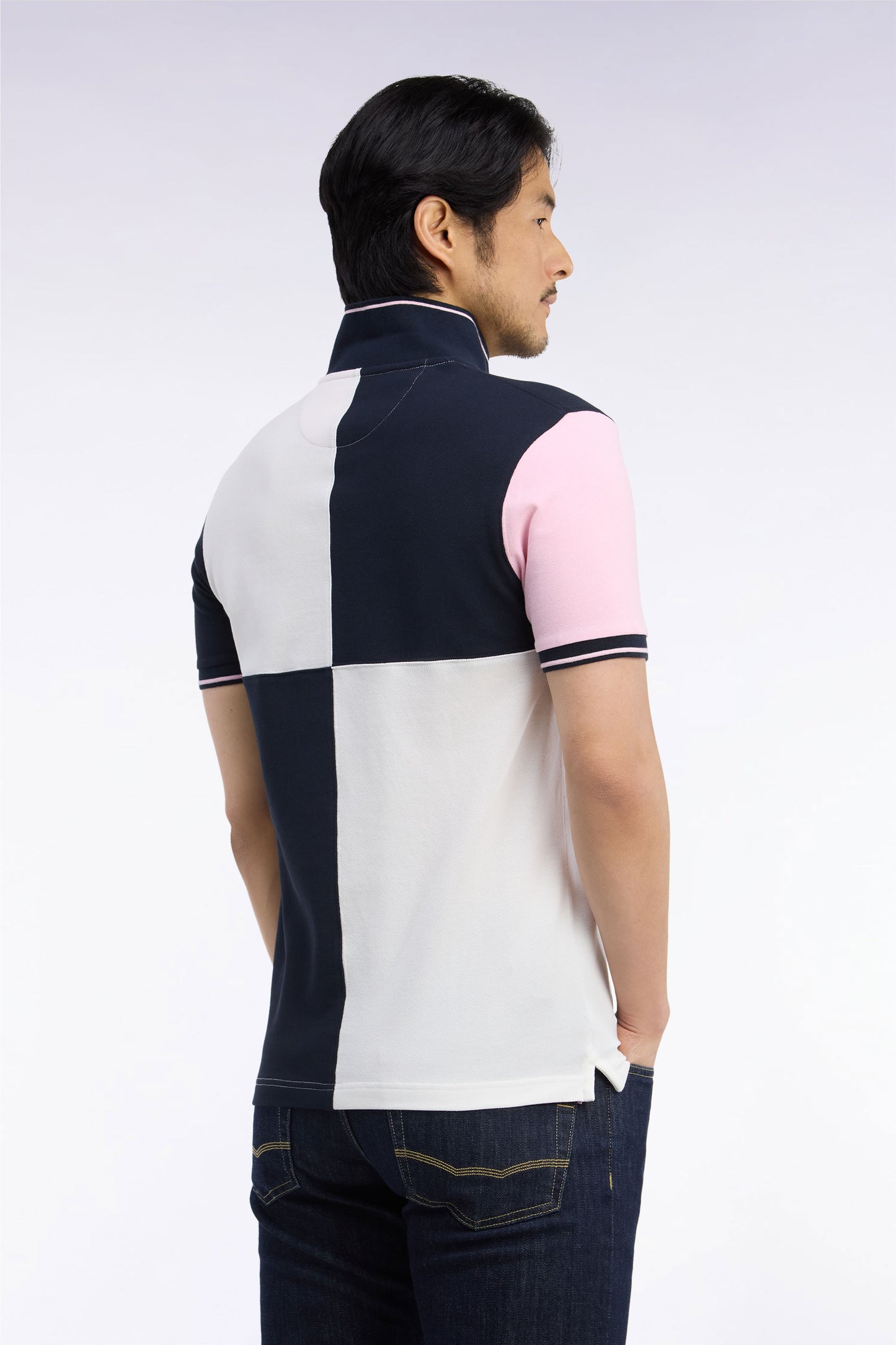 Polo manches courtes en piqué de coton tricolore à découpes écru coupe droite