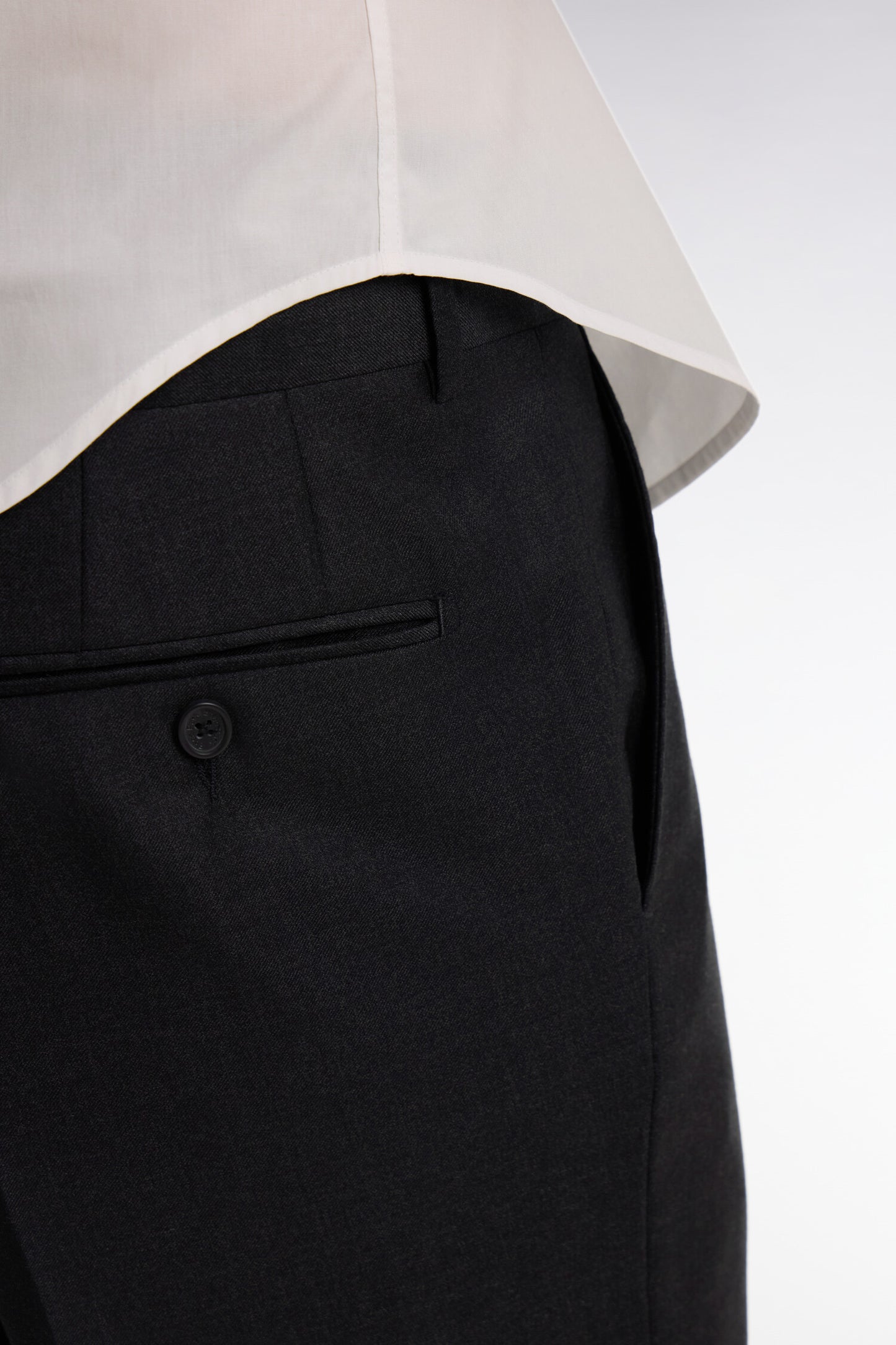 Regular dark grey wool trousers with broken fold