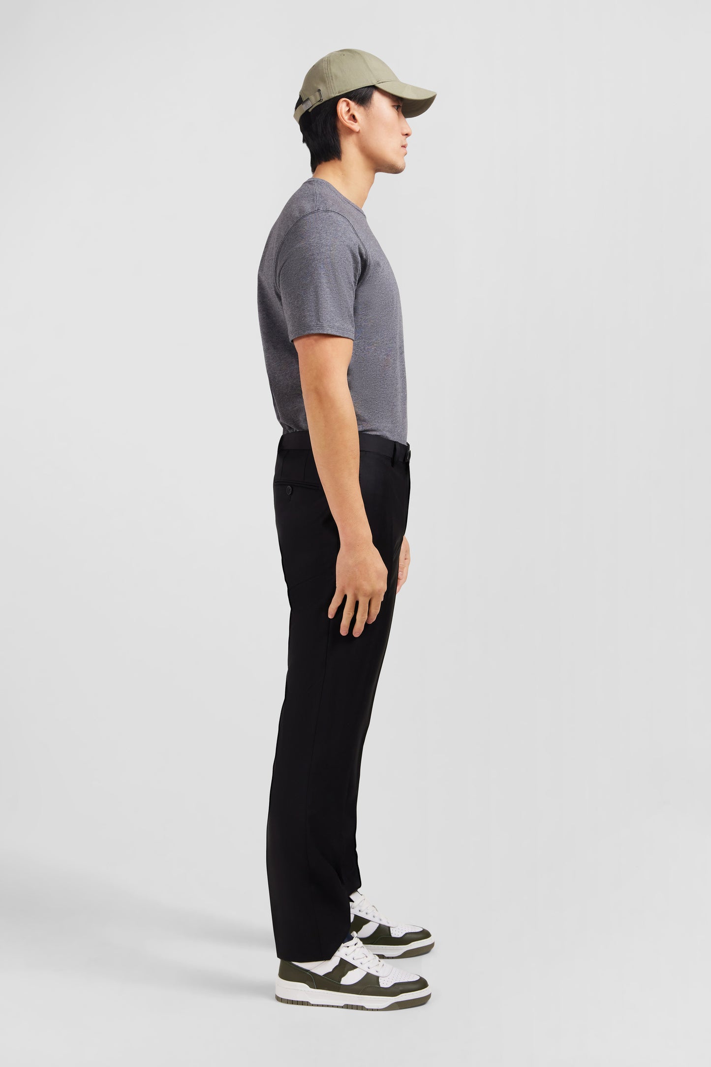 Pantalon slim noir en laine à plis cassés